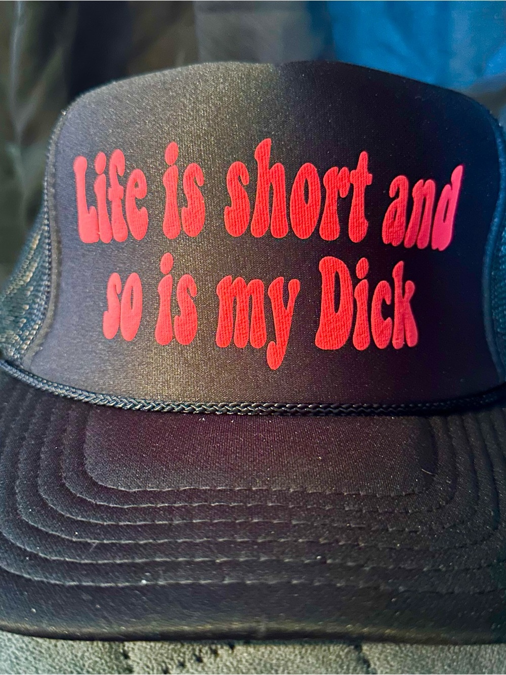 Black Trucker Hat with Bold Red Slogan